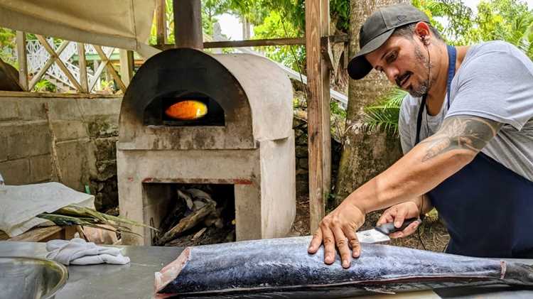 Alex with fish Chef fillets a whole fish