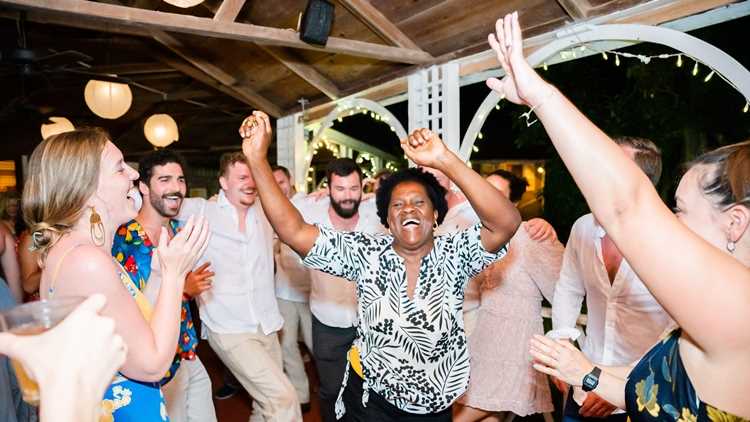 Staff and guests dancing together