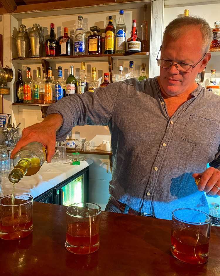 Richie pouring rum at the bar