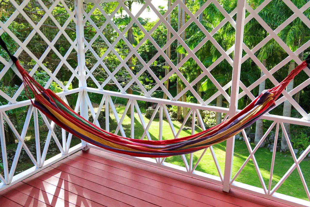 Hammock on the veranda of a gingerbread cottage