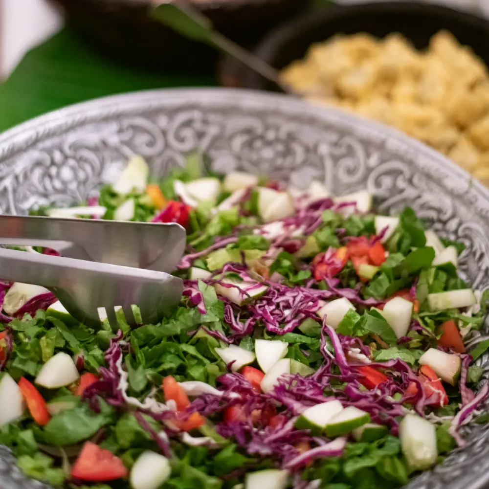 A fresh garden salad served in a carved wooden bowl at Hermitage Nevis