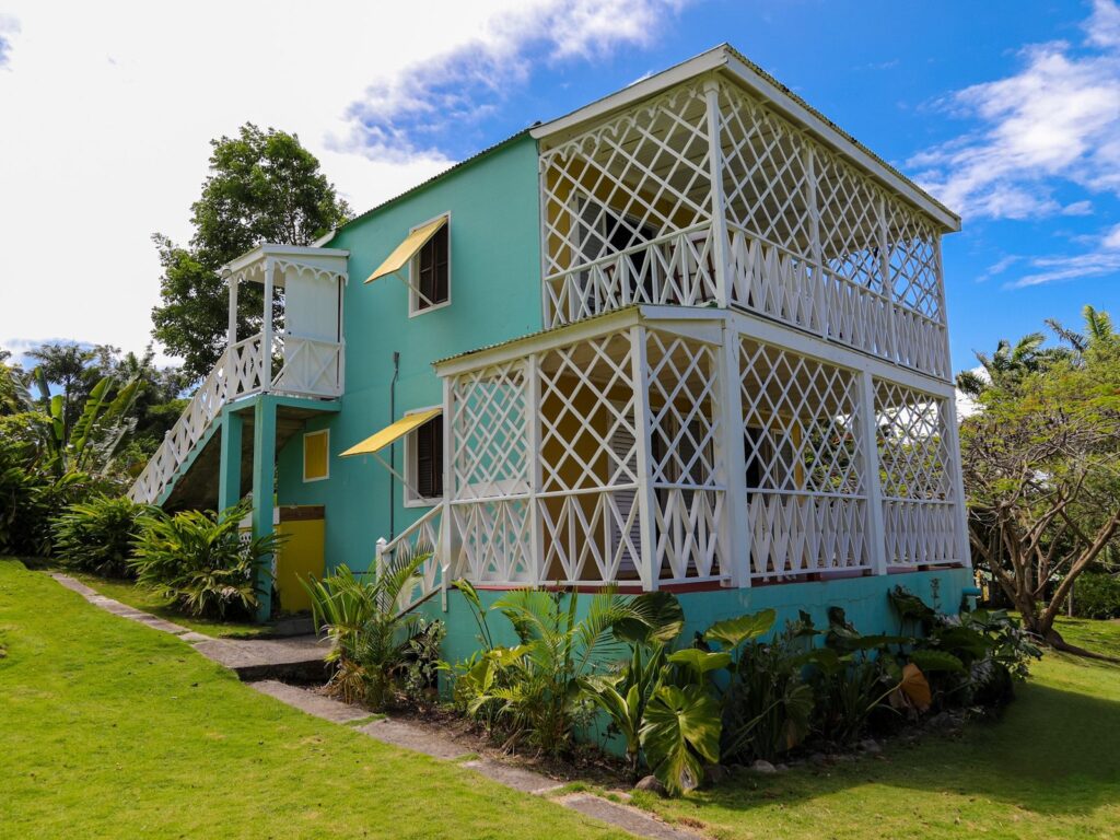 Two-storey rooms building at Hermitage Nevis, its verandahs and balconies screened with white latticework
