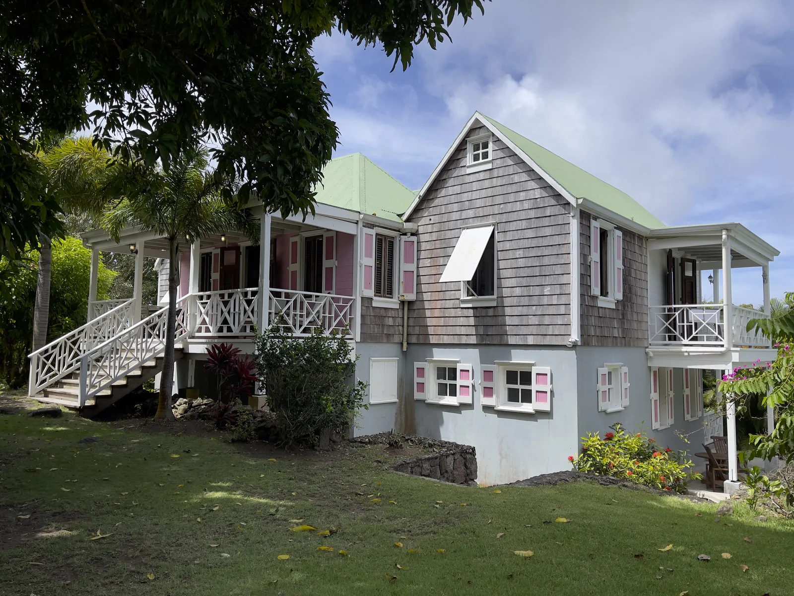 Rose Villa from the garden, showing its verandah, shingled gable and lower floor