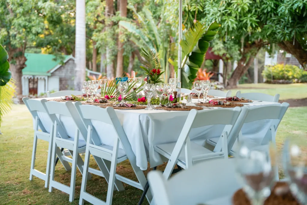 Wedding reception table set with tropical flowers at Hermitage Nevis