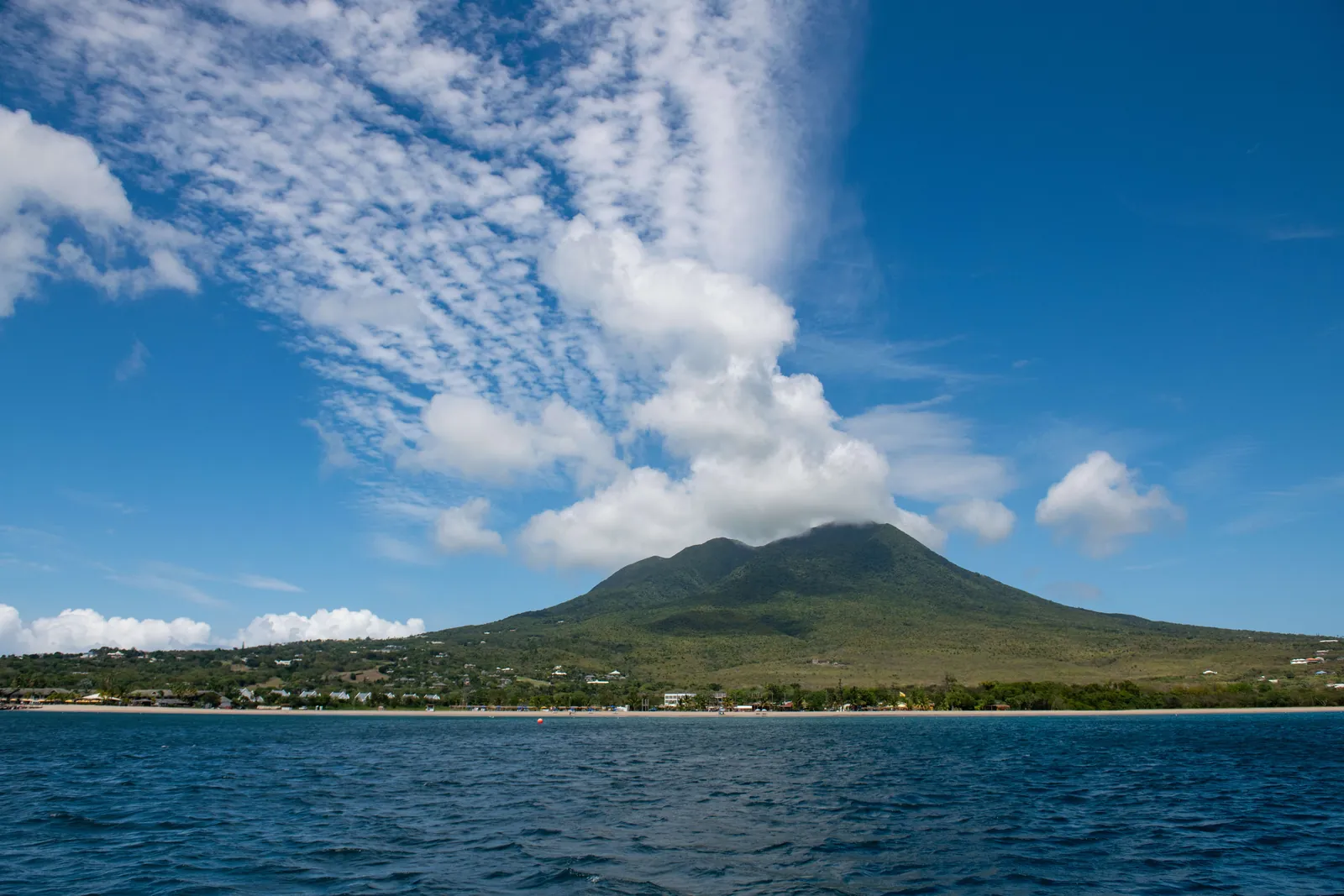 Nevis Peak seen across the water, its summit under cloud
